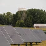 Hydra Solar Panels with Trees and Shed in Background