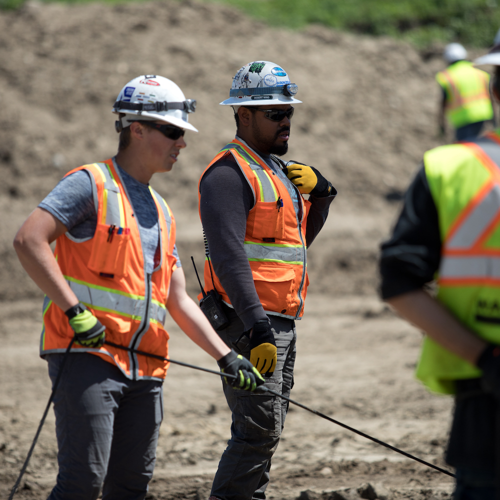 Men in construction clothing and hard hats