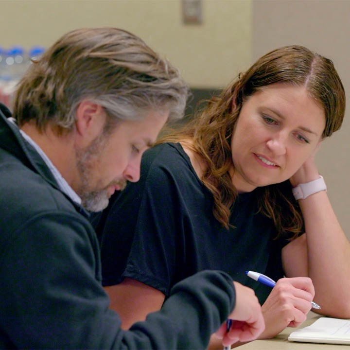 Man and woman review documents