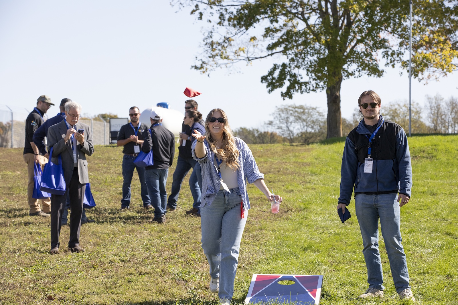 People playing cornhole