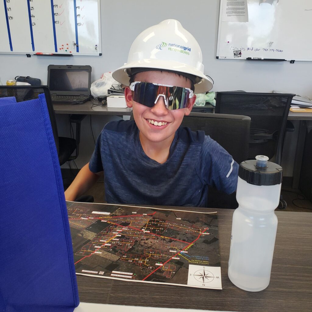 Kid with hard hat and glasses