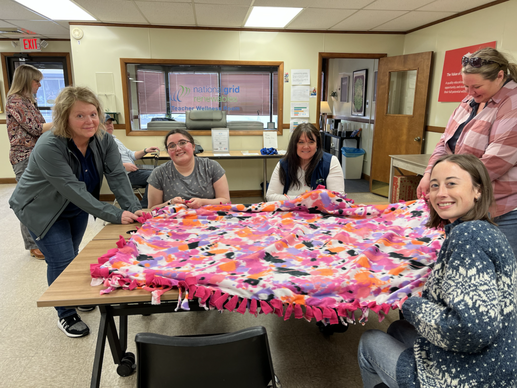 People making tie blankets
