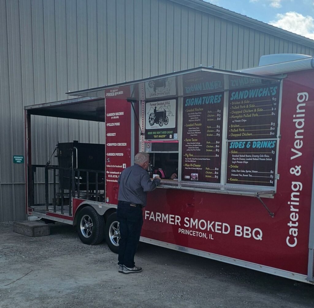 Man at Farmer Smoked BBQ food truck