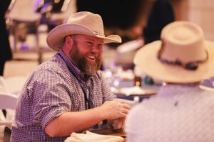 Photo of Ricky Austin - Sr. Renewable Project Manager at NRG, at the welcome reception in the Hillside Pavillion at Omni Barton Creek Resort and Spa.