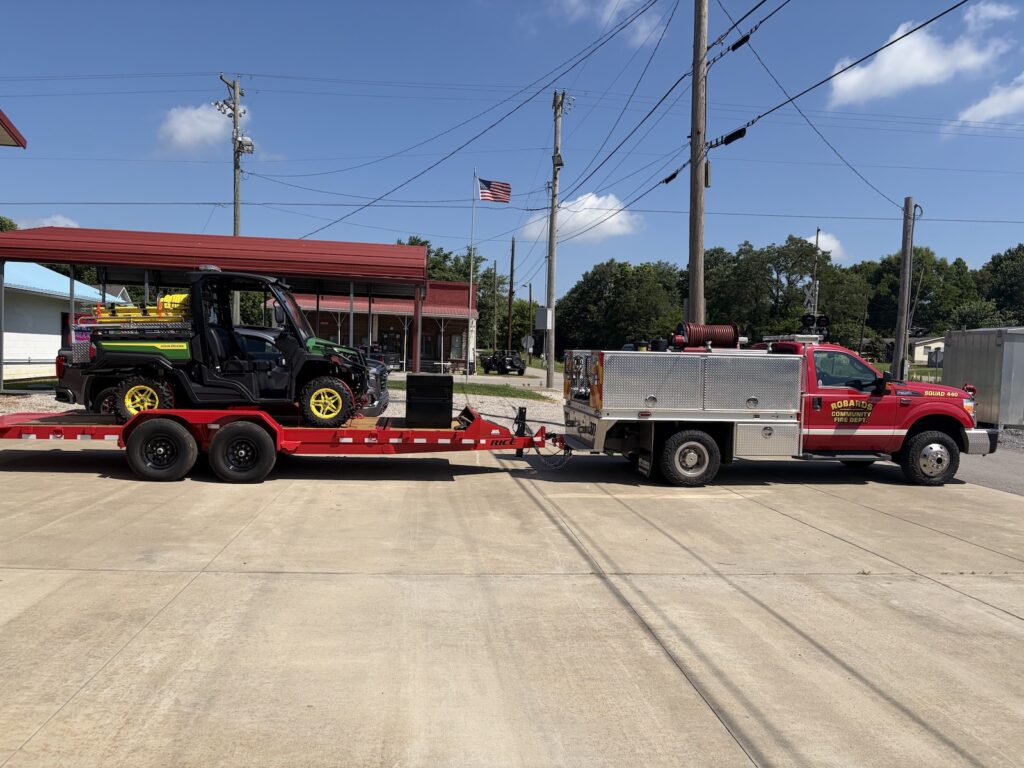 Fire department truck towing UTV